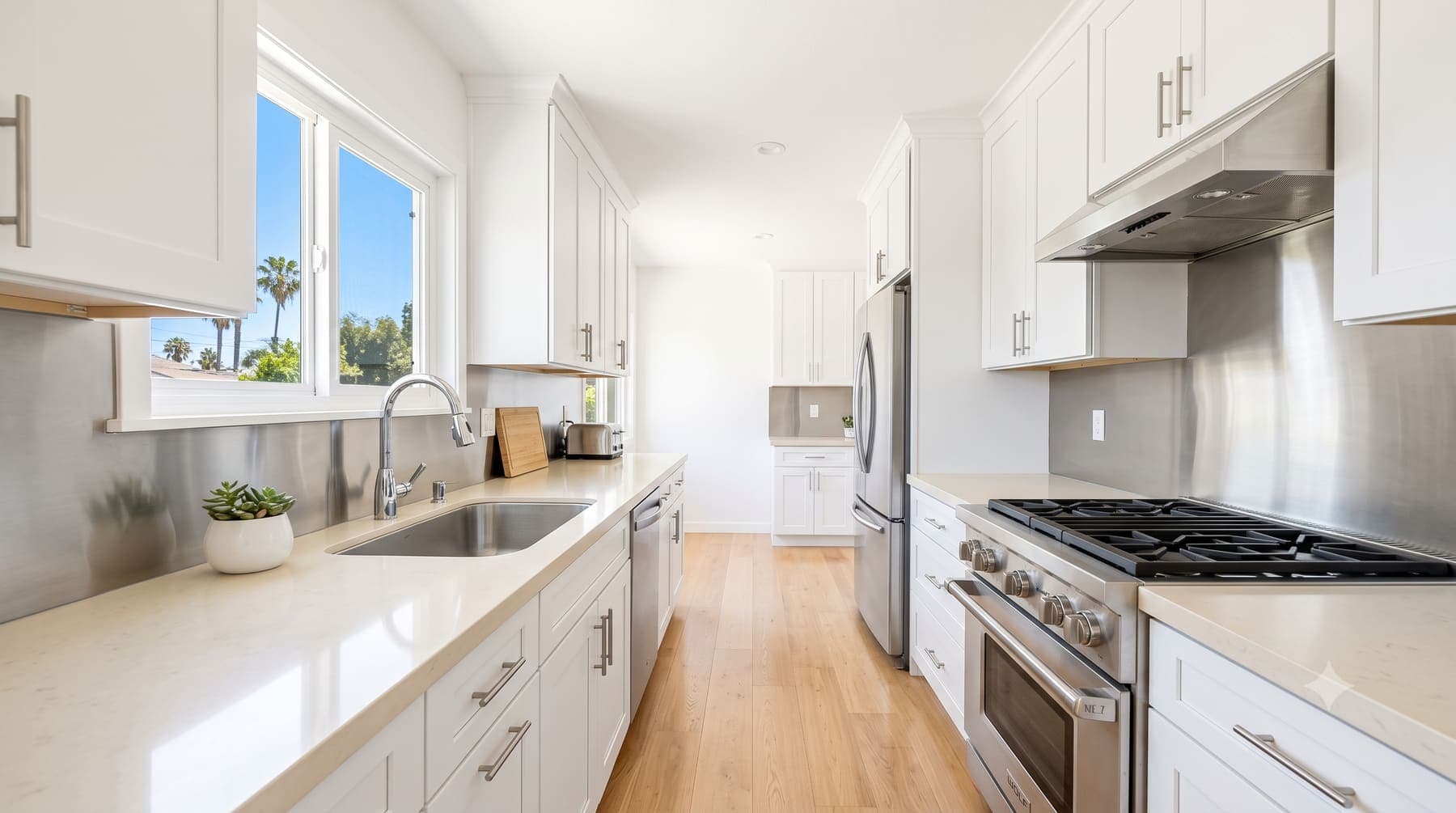 The same kitchen after Rosa's clean — spotless counters, floors and range